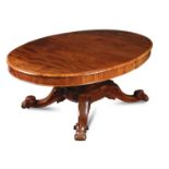 A large William IV mahogany pedestal dining table, the D end top extending to accommodate two