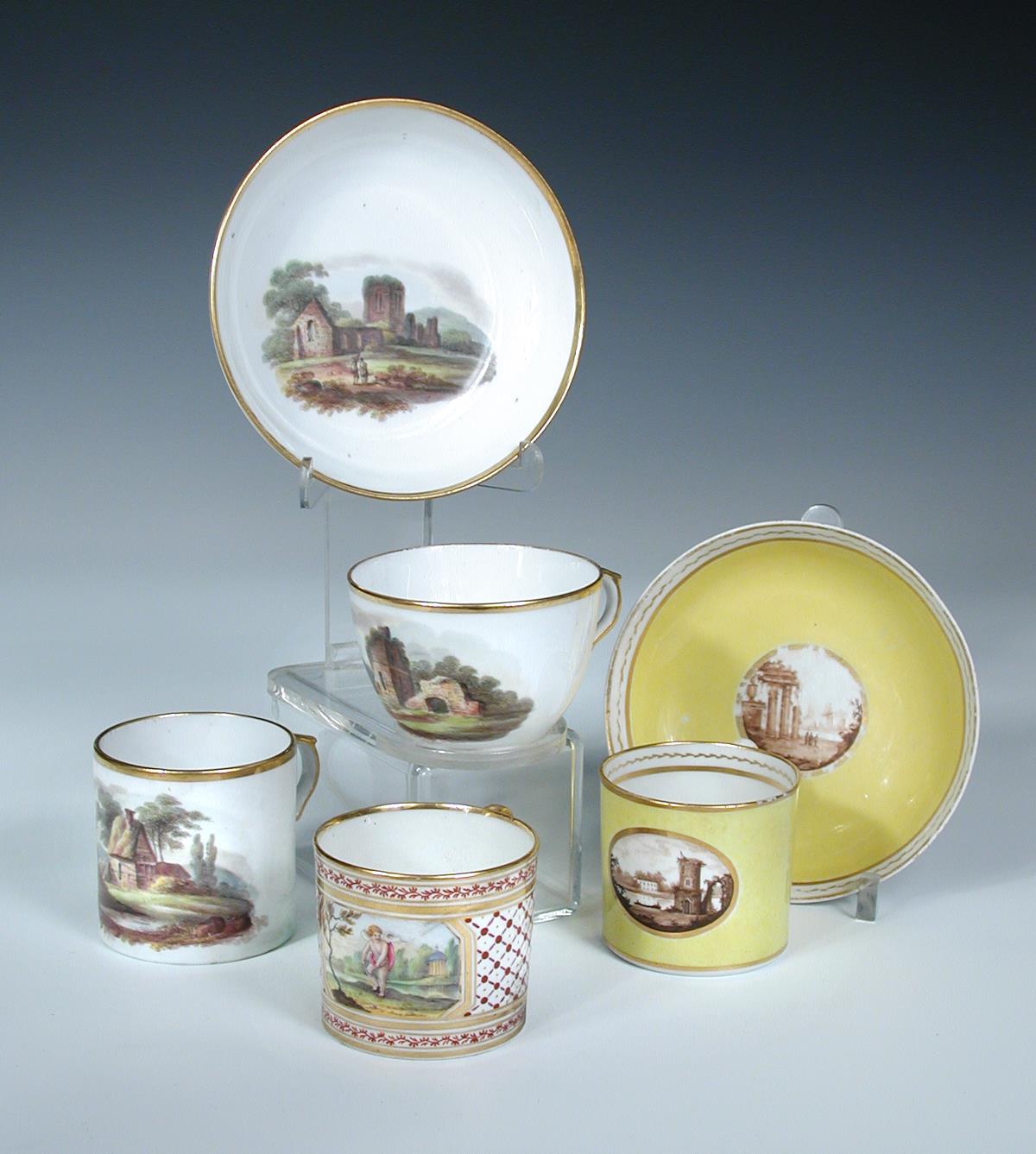 A Coalport trio, a can and saucer and a single can, the first painted with ruins in a landscape, the - Image 2 of 3