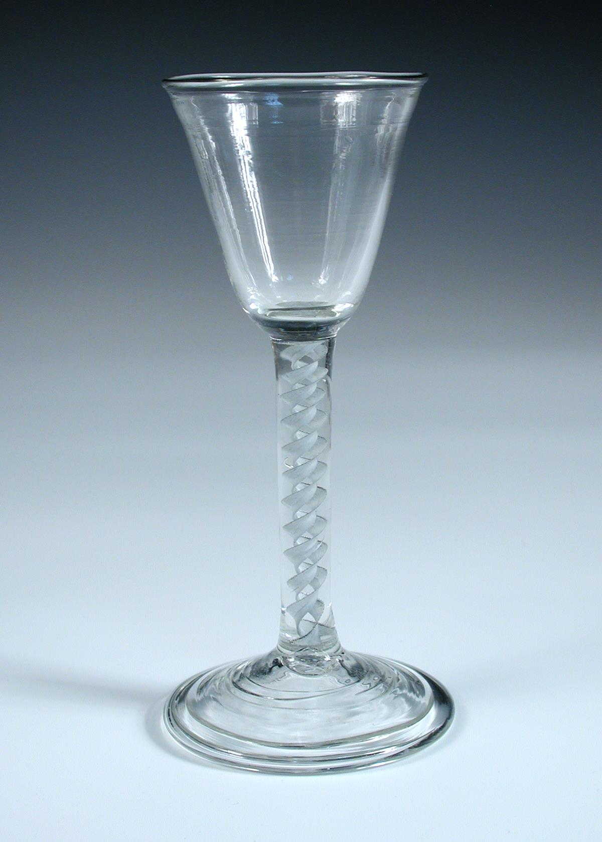 An 18th century soda glass, the conical bowl with a slight flare into the rim on opaque twist stem - Image 2 of 2