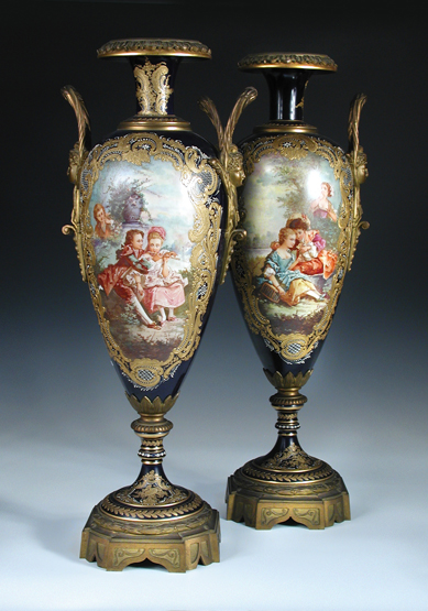 A pair of late 19th century/early 20th century Sevres porcelain vases, painted by Jean Armand with