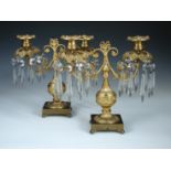 A pair of late 19th century gilt metal lustre candelabra, each with two lights above bead and