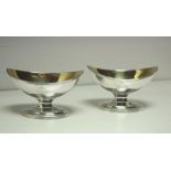 A pair of George III silver pedestal salts, by William Abdy, London 1786, of plain oval form with