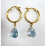 A pair of briolette cut blue topaz ear hoops, each designed as a 1.8cm diameter hoop of unmarked