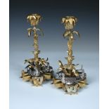 A pair of late 19th century ormolu candlesticks modelled as leafy water plants, each with three