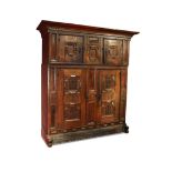 A German oak marriage cupboard, 17th century the frieze later carved in German translated as ' Lord,