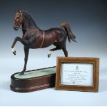 A 1975 Royal Worcester 'Hackney Stallion' by Doris Lindner, Number 246 of 500, the bay doing a