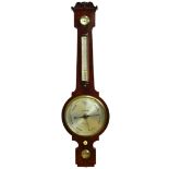 Dollond London, a mahogany wheel barometer, 19th century, with four silvered dials below a