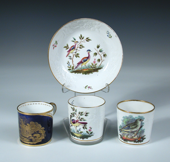 A Spode coffee can and saucer and two other Spode cans, the first painted with pattern number 2099