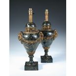 A pair of gilt metal mounted marble table lamps, of mottled dark green urn form with ram's head