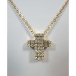 An 18ct gold and diamond set cross and chain by Asprey's, the small solid latin cross pavé set to