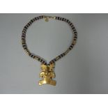 A South American gilt and hardstone pendant and bead necklace, the necklace with alternating