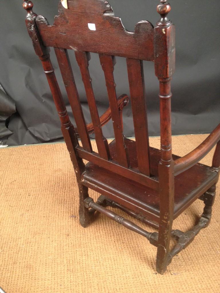 A Carolean oak armchair, with shaped crest rail, turned rail and slat back, scrolling arm - Image 3 of 6