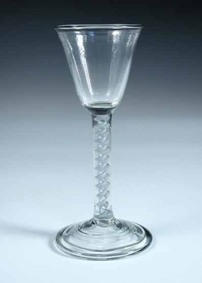 An 18th century soda glass, the conical bowl with a slight flare into the rim on opaque twist stem