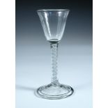 An 18th century soda glass, the conical bowl with a slight flare into the rim on opaque twist stem