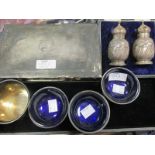 Three Victorian silver salts with blue glass liners, together with a silver christening mug, a