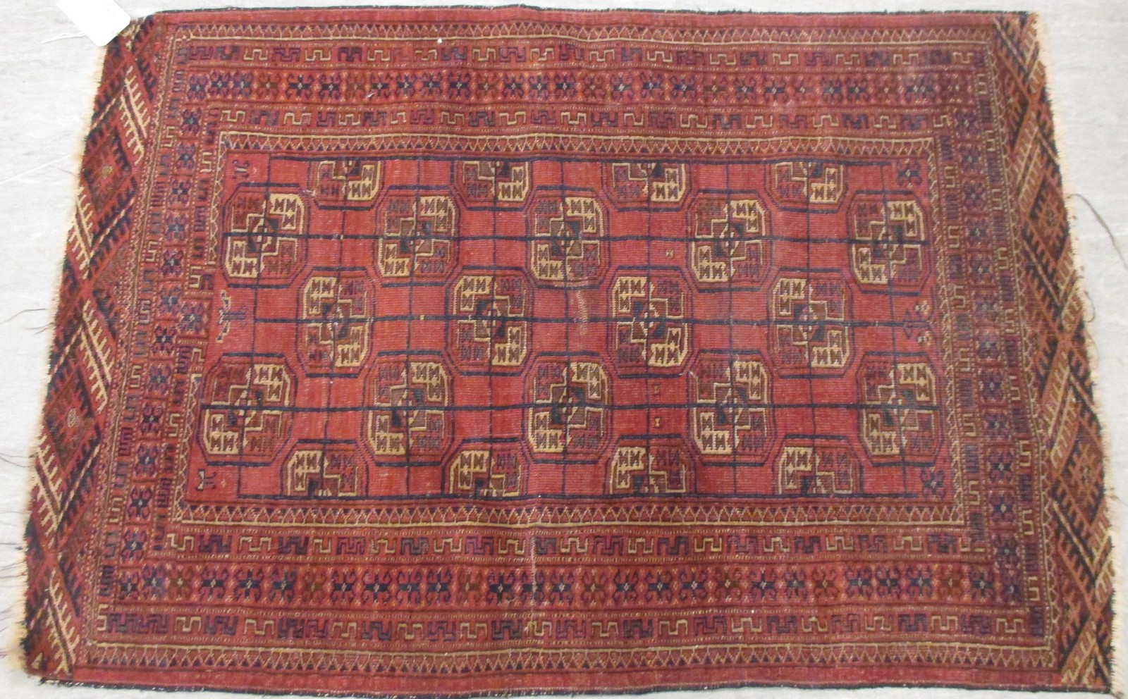 A Tekke rug on a red ground, 184 x 128cm together with two others, 140 x 96cm, 140 x 82cm (3) - Bild 2 aus 3