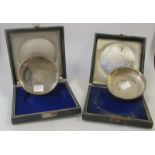 A pair of cased silver ashtrays