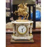 A gilt metal and alabaster mantle clock surmounted with a figure on a rearing horse