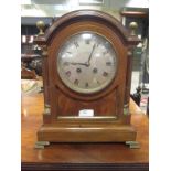 A 20th century mahogany and brass inlaid mantle clock