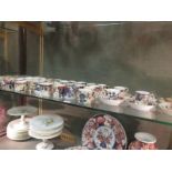 A large collection of Derby & other Imari palette coffee cans & saucers