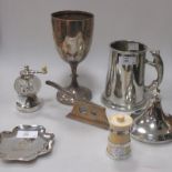 A modern silver cigar cutter, a silver small trophy cup, an early 20th century ivory pepper mill