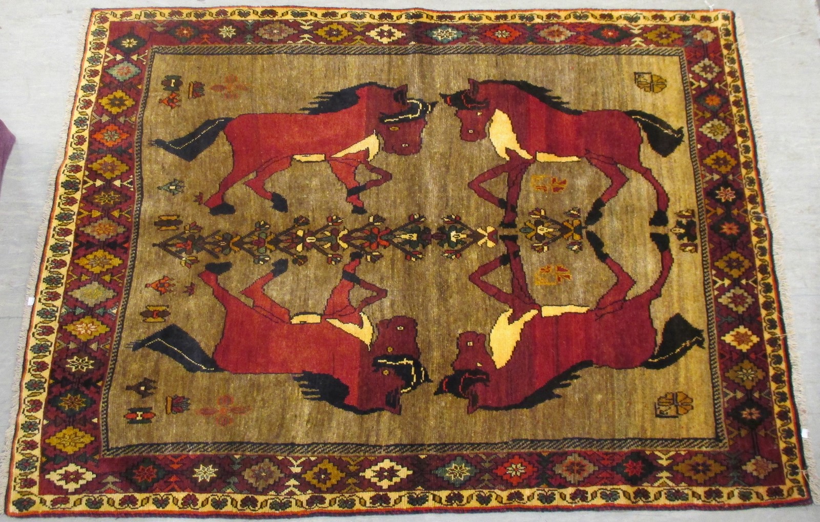 A rug decorated with horses, 210 x 153cm