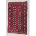 A Tekke rug on a red ground 132 x 80cm, together with a prayer rug (2)