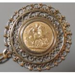 A 1905 sovereign set in a 9ct scrolling filigree style mount, gross weight 16.2g