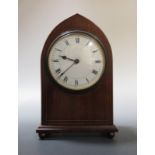 Two arched case mahogany mantel clocks and an oak mantel clock (3)