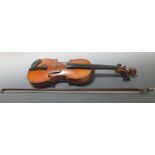 An early 20th century violin and bow, label for Stradivarius