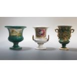 Two Derby and a Spode urn, the first of campana shape with snake handles and painted with flowers on