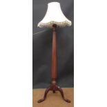 Two mahogany standard lamps