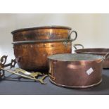 Three copper and brass pans and a brass wall bracket