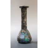 A small Roman glass bottle in excavated condition, with certificate