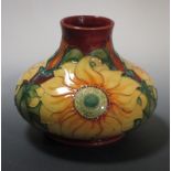 A Moorcroft Inca pattern vase, decorated with sunflowers on a rust coloured ground, c.1994,