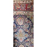 A Persian blue ground carpet with red border, 370 x 240cm
