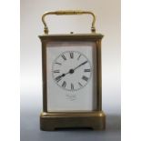 A brass repeating carriage clock, enamel dial, gong strike, by Richard & Cie