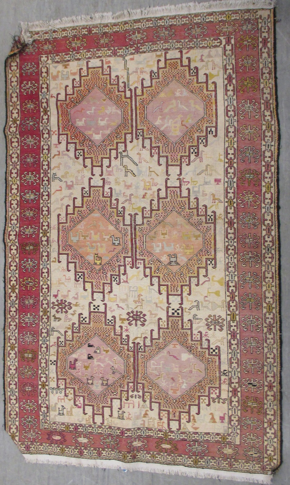 A faded pink ground rug, 130cm x 200cm and a modern red ground rug 125cm x 207cm (2)