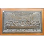 A coppered iron plaque of the 'Last Supper' in a frame