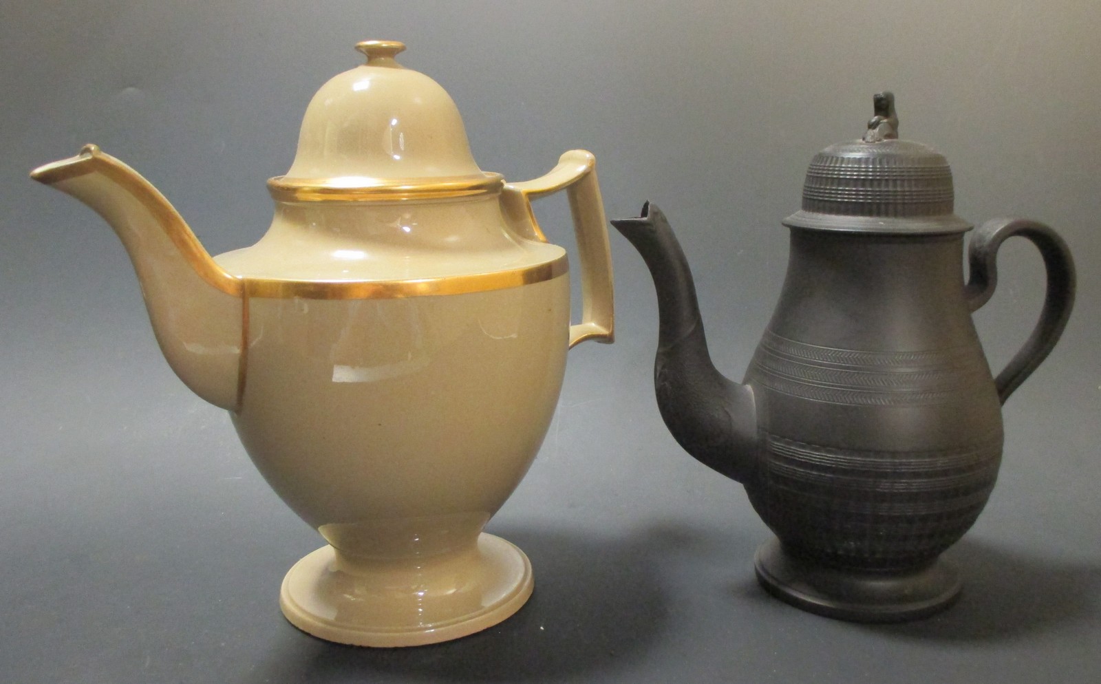 A Wedgwood black basalt coffee pot & cover & another drabware pot (2)