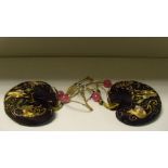 A pair of embroidered black silk purses, the heart shapes worked in gold threads with finger