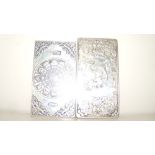 Two silver rectangular bar trade tokens, both cast with the signs of the zodiac on one side, the