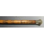 A late 19th century walking cane, scratch carved and soot heightened depicting scenes