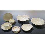 A pair of early 19th century creamware scallop shaped dishes, together with other scallop dishes,