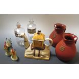 A camel teapot, two ale jugs, a chicken cruet set and two drug bottles