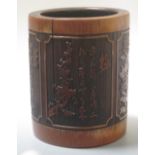 A carved bamboo brush pot, 14.5cm tall