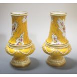 A pair of Royal Worcester yellow ground and floral painted vases by Harry Chair, 19cm high