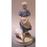 A Royal Copenhagen figure of a girl with a goose, 22cm tall