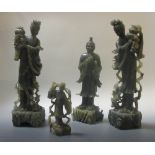 A collection of four carved stone figures