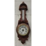 An Edwardian oak cased barometer
